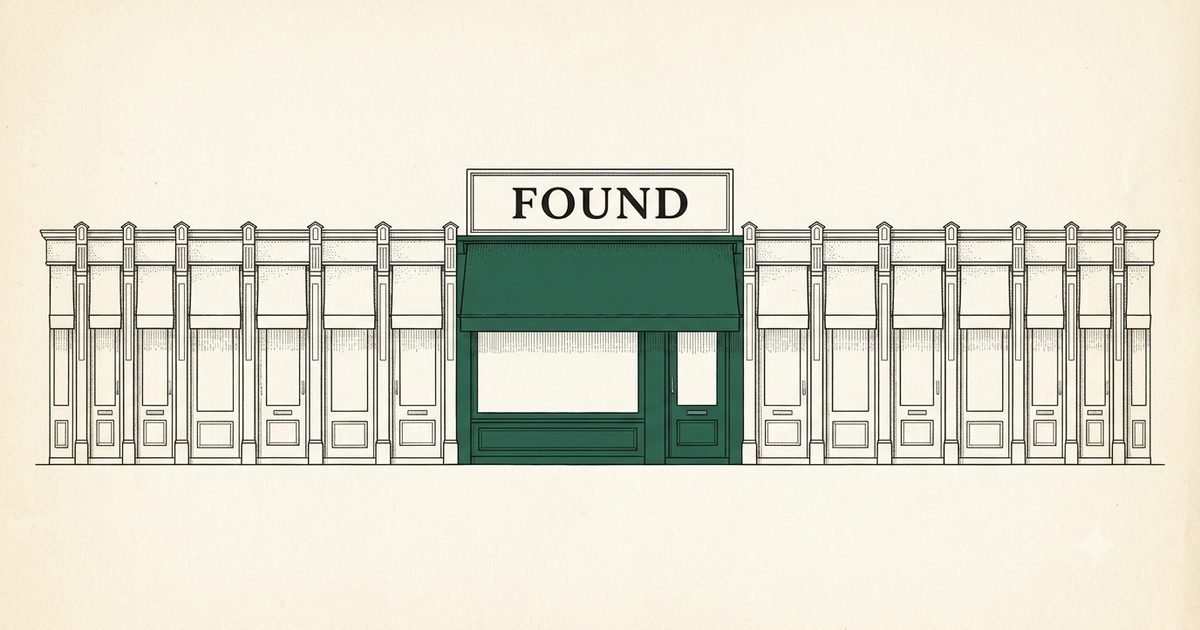 A row of small shopfronts squeezed aside by one giant green storefront whose sign reads FOUND.